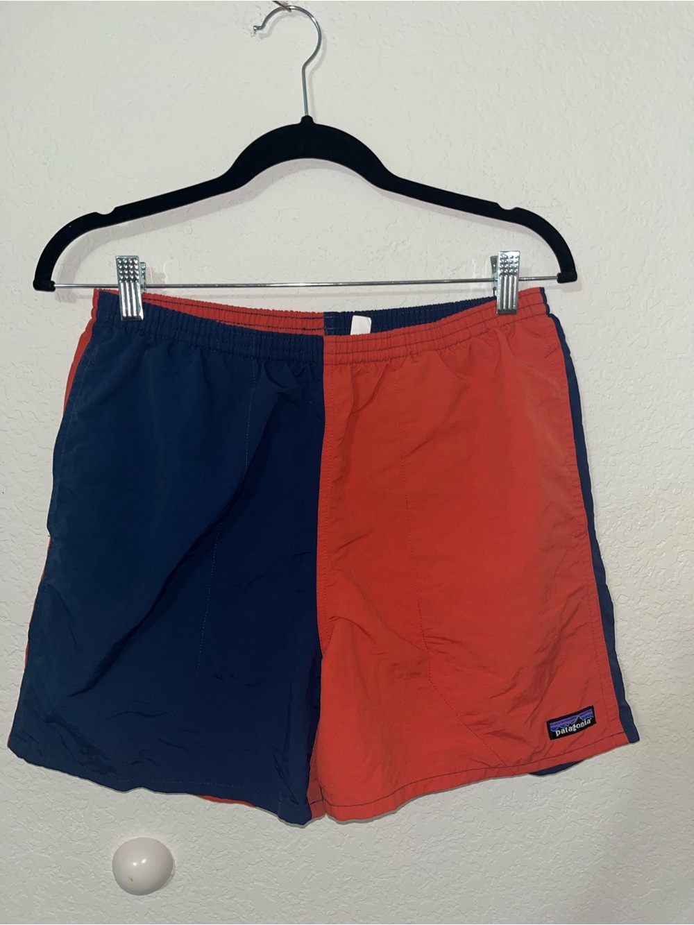 Patagonia men’s orange and navy color block baggies shorts